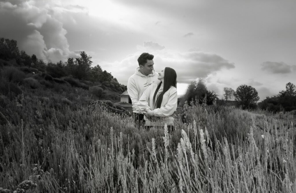 A man standing in a field of tall grass
